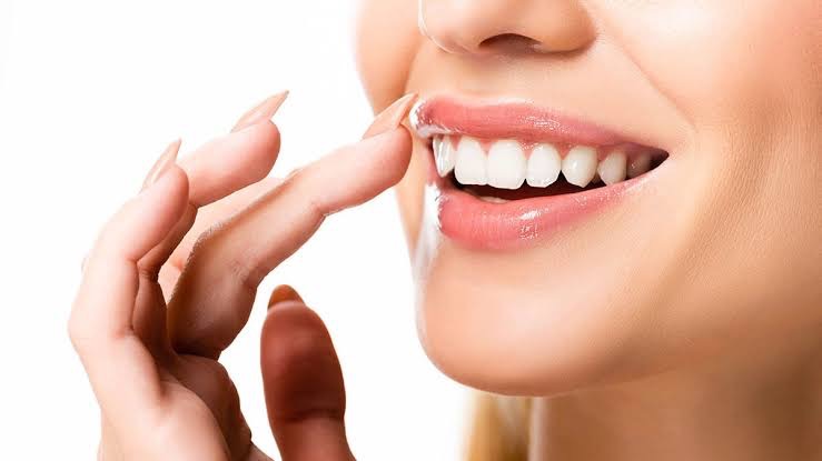 A person smiling after a professional teeth whitening treatment